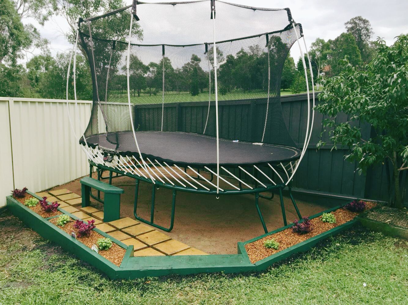 Trampoline in a backyard